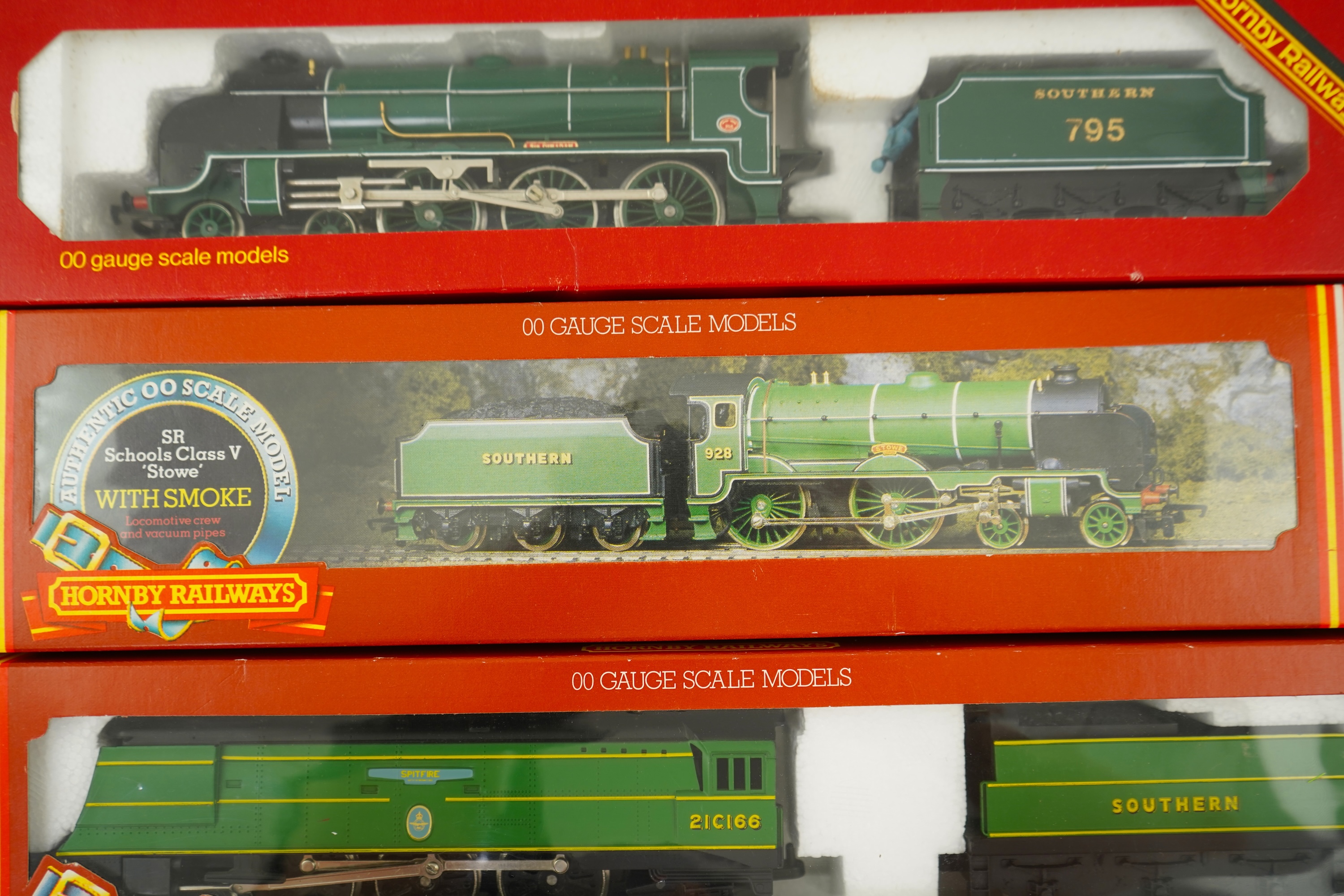 Three boxed Hornby Railways 00 gauge Sputhern Railway tender locomotives; a Battle of Britain Class, Spitfire 21C166, (R374), a Schools Class, Stowe 928, (R380), and a Class N15, Sir Dinadan 795 (R154)